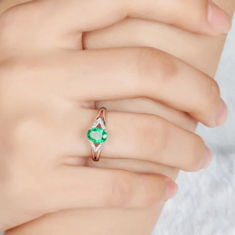 Solitaire Oval Emerald Ring with Trio Diamond Accents